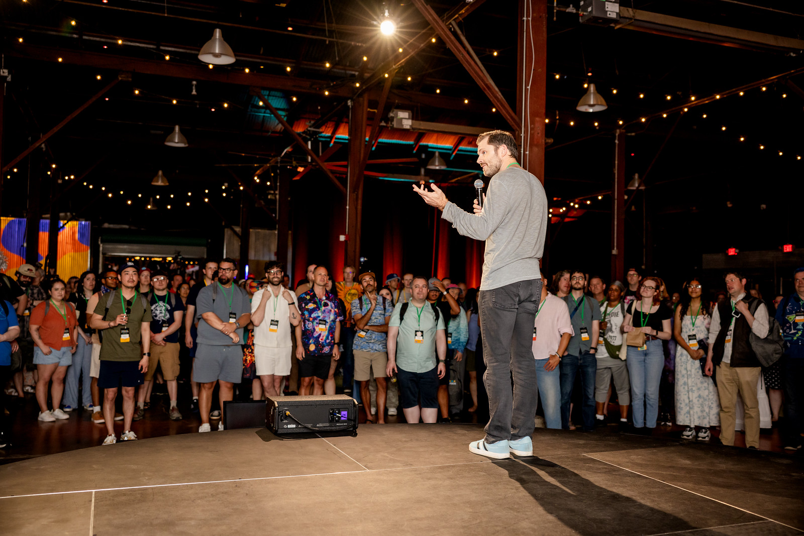A speaker addresses a crowd gathered around the stage at ND26